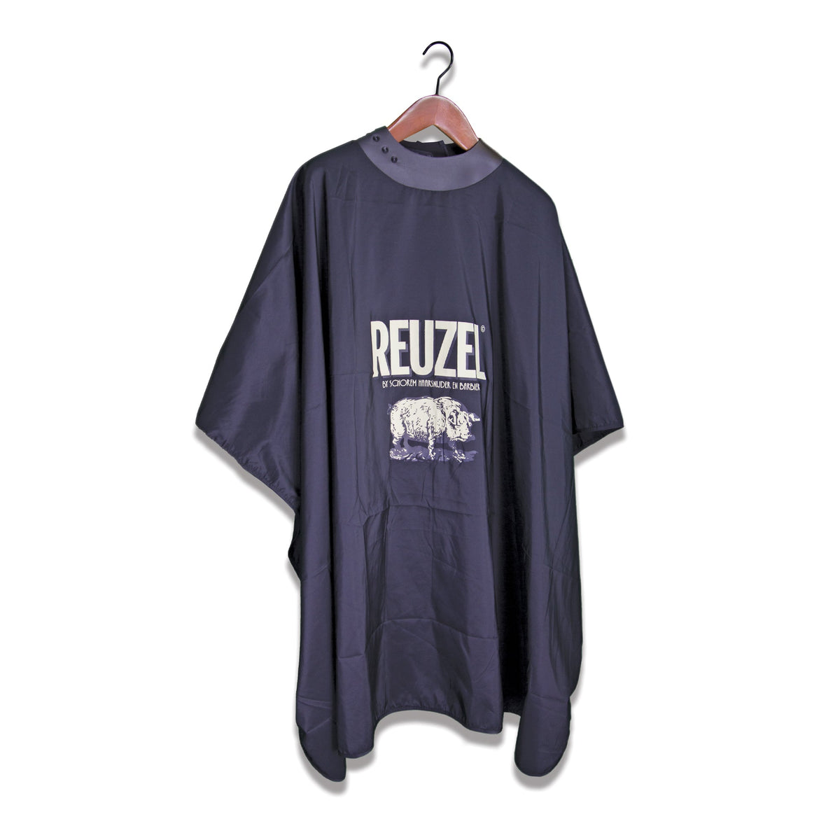Black hairdressing cape with 'REUZEL' branding against a white background