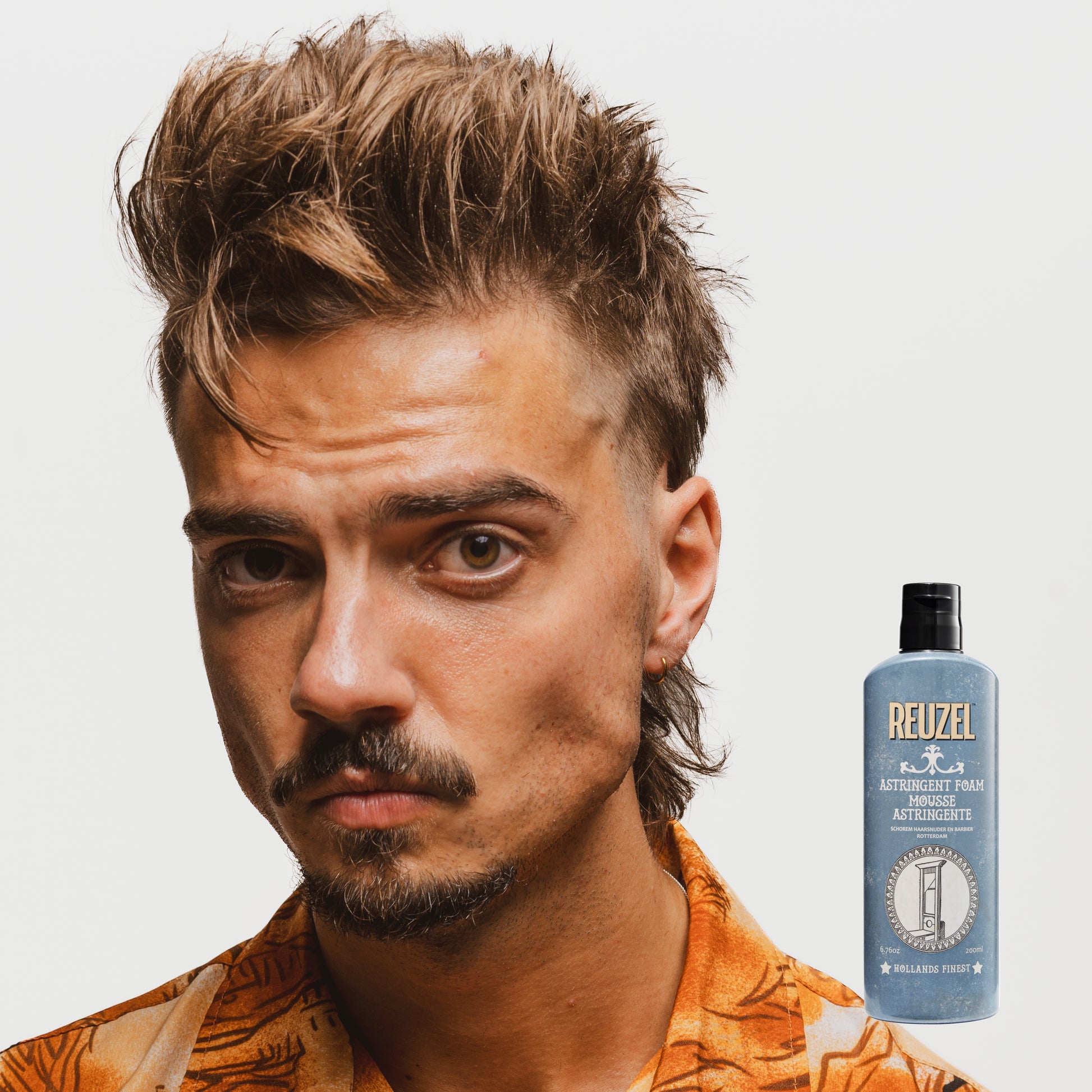 Reuzel Astringent Foam beard grooming product in a tube, designed for refreshing and tightening skin after shaving.