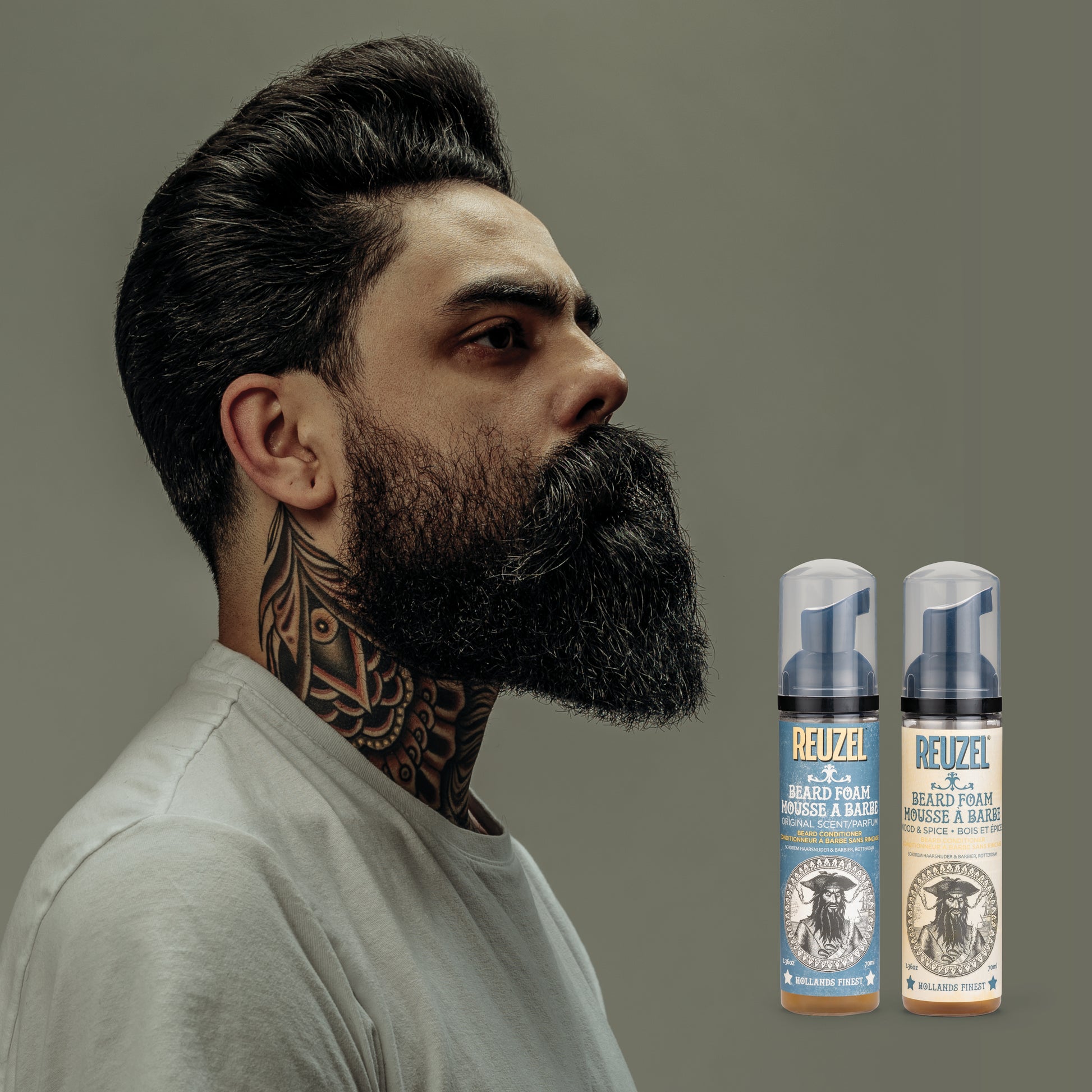 Reuzel Wood & Spice Beard Foam in a bottle, designed for grooming beards with a natural wood and spice scent.