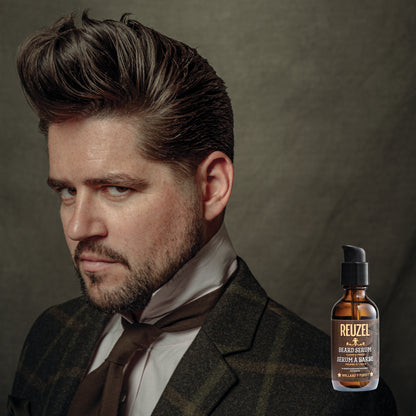 Reuzel beard oil in a clear bottle showing the clean and fresh beard serum, designed to nourish and soften facial hair.