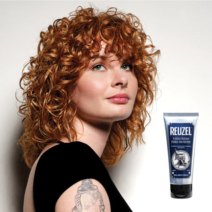 Reuzel Fiber Cream hair styling product in a jar, showing its thick, fiber-rich texture for flexible hold and natural finish.