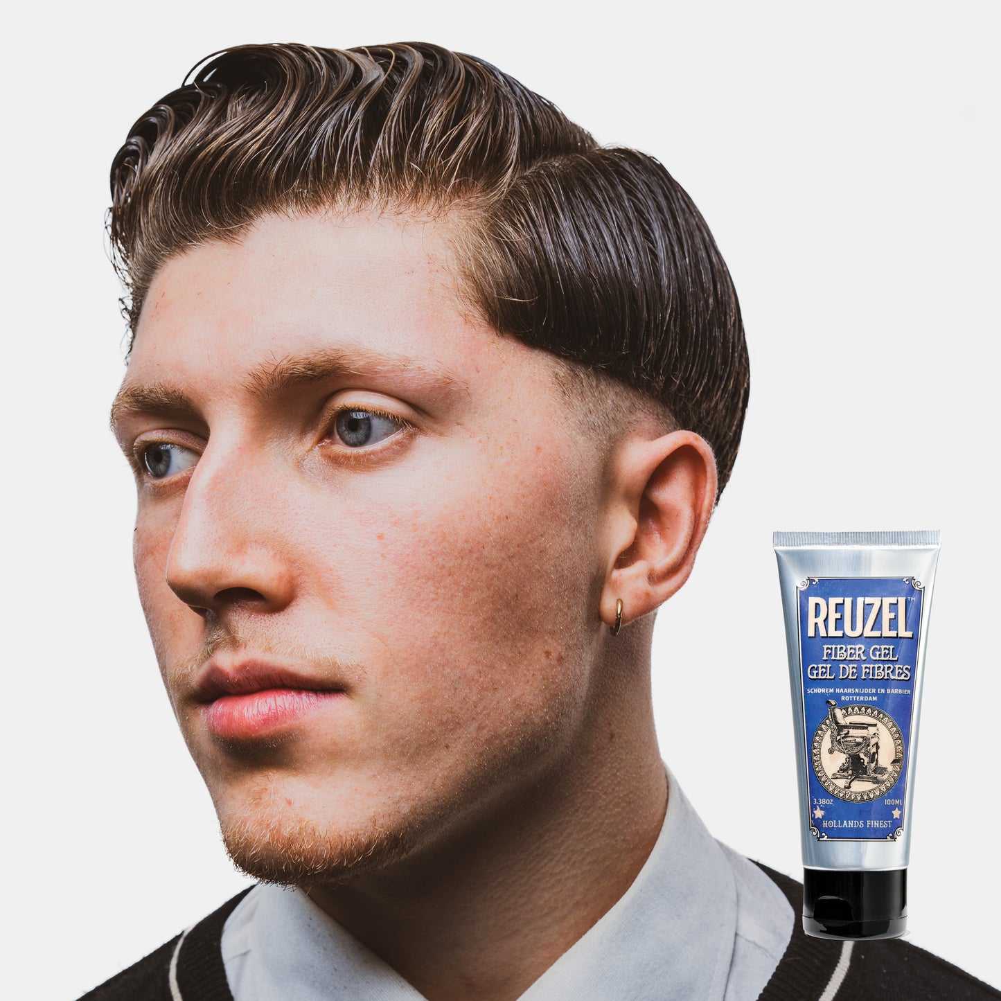 Reuzel Fiber Gel hair styling product showing a close-up of the gel texture in a container, ideal for thick, strong hold styling.