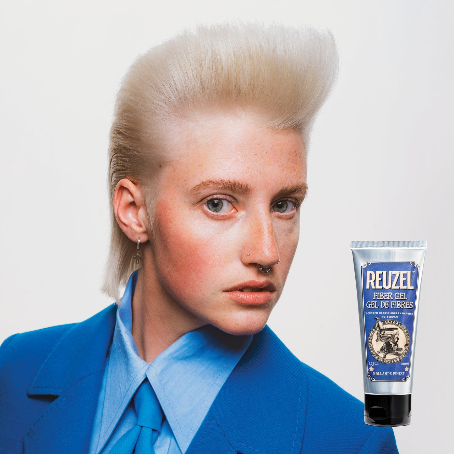 Reuzel Fiber Gel hair styling product in a white tube, designed for strong hold and textured hairstyles.
