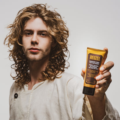 Reuzel Grooming Tonic Texture Cream for hair styling, showing a jar with cream texture and modern packaging.