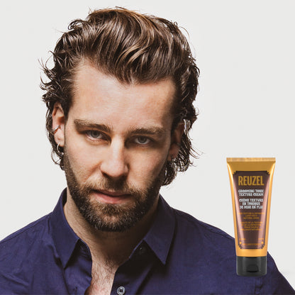 Reuzel Grooming Tonic Texture Cream in a jar, showing the creamy hair styling product with a textured surface and minimalist design.
