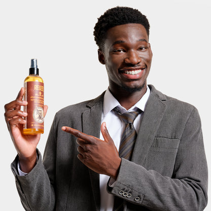 Reuzel Spray Grooming Tonic in a spray bottle, designed for hair styling and grooming.