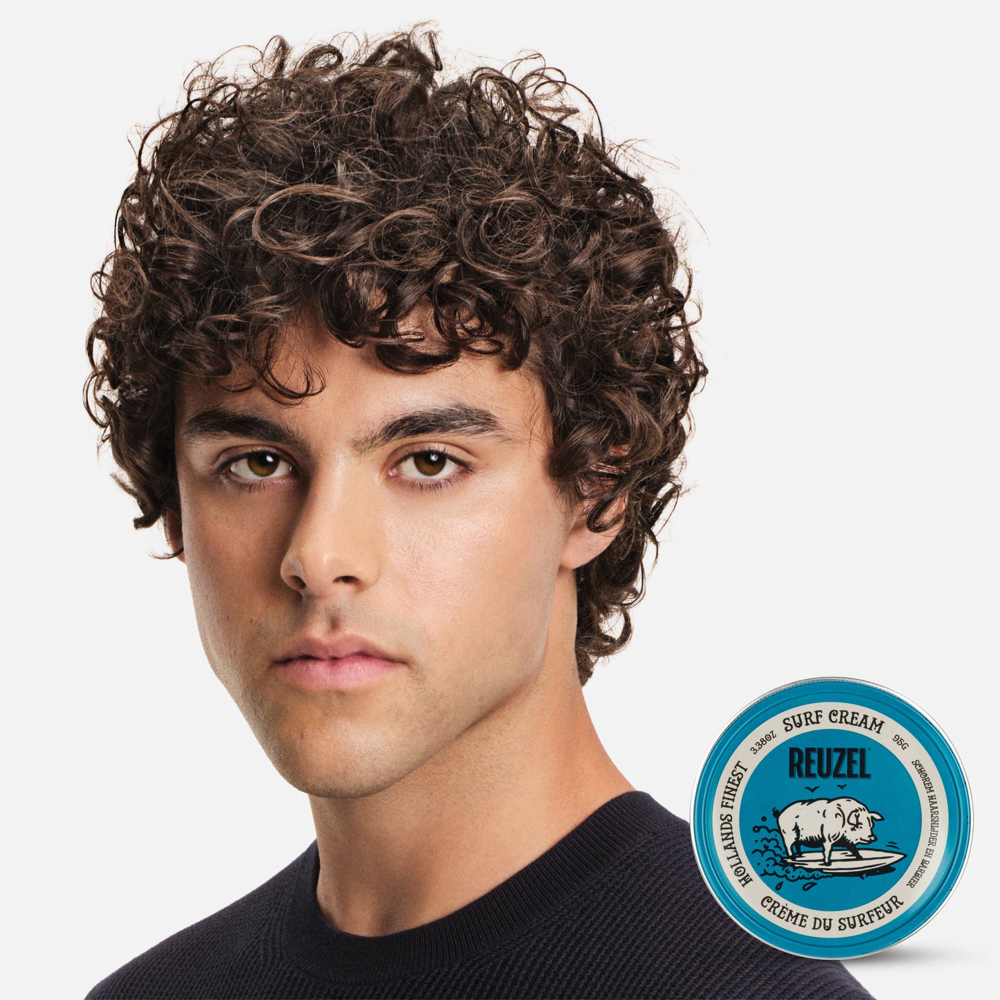 Reuzel Surf Cream pomade in a jar, showcasing the product's creamy texture and branding for textured, beachy hairstyle.