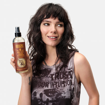Reuzel Surf Tonic salt spray bottle for textured, tousled beach-inspired hair styling.